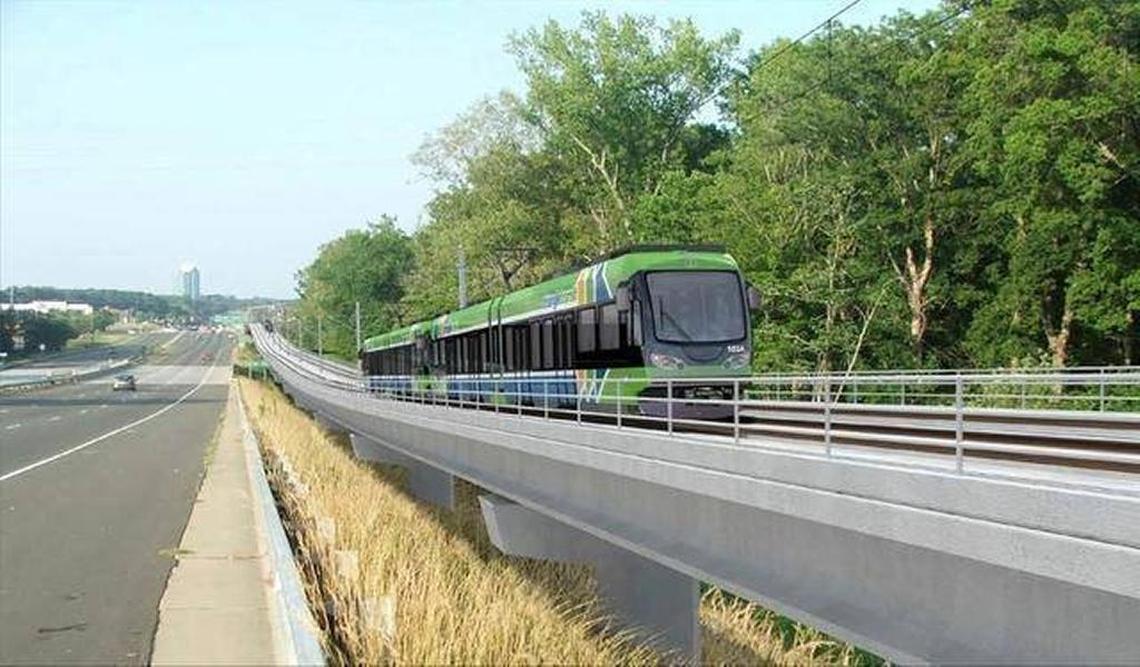 A concept illustration shows a train on the future Durham-Orange Light-Rail Transit traveling alongside U.S. 15-501.