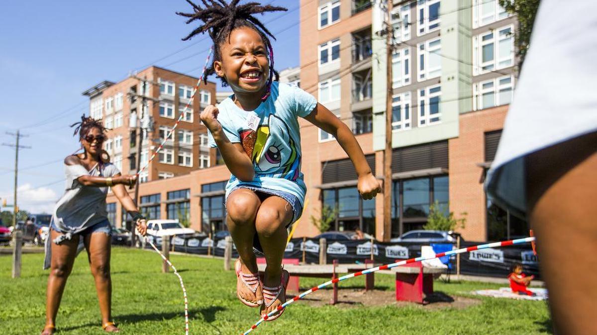 Cypress Roane plays the jump rope game Double Dutch during Black August in the Park at Durham Central Park in 2017.