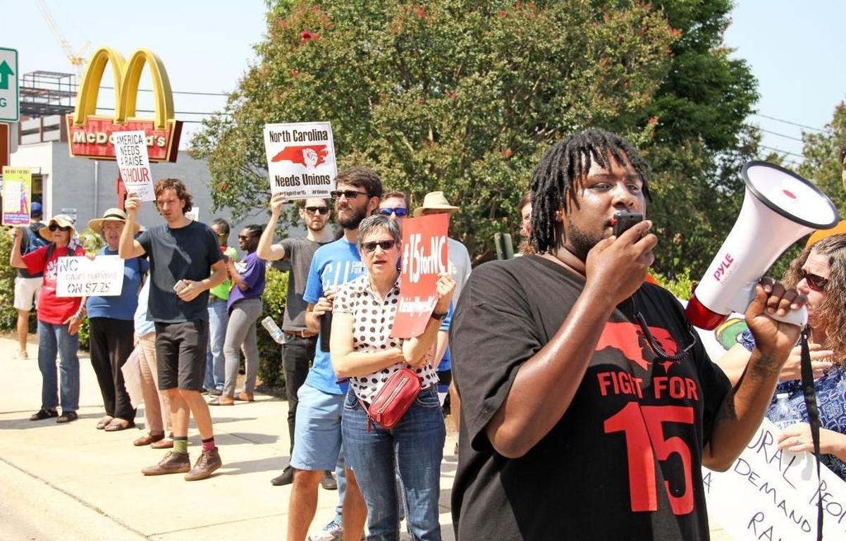 Keith Bullard leads marchers in a demonstration outside the downtown Durham McDonald’s on Sept. 4, 2017, calling for a $15 per hour wage and the right to unionize for fast-food and other service-industry workers.
