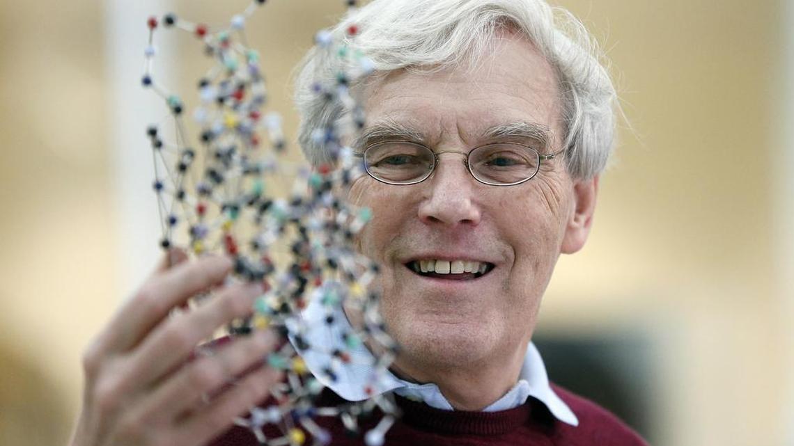 Richard Henderson, one of the 2017 Nobel Prize winners in chemistry, holds a molecular model prior to a news conference at the Laboratory of Molecular Biology in Cambridge, England, on Wednesday. He is one of a trio of researchers who shared this year’s Nobel for helping develop cryo-electron microscopy, a technology Duke University, UNC-Chapel Hill and the National Institutes of Environmental Health Sciences are spending millions on to bring to the Triangle.