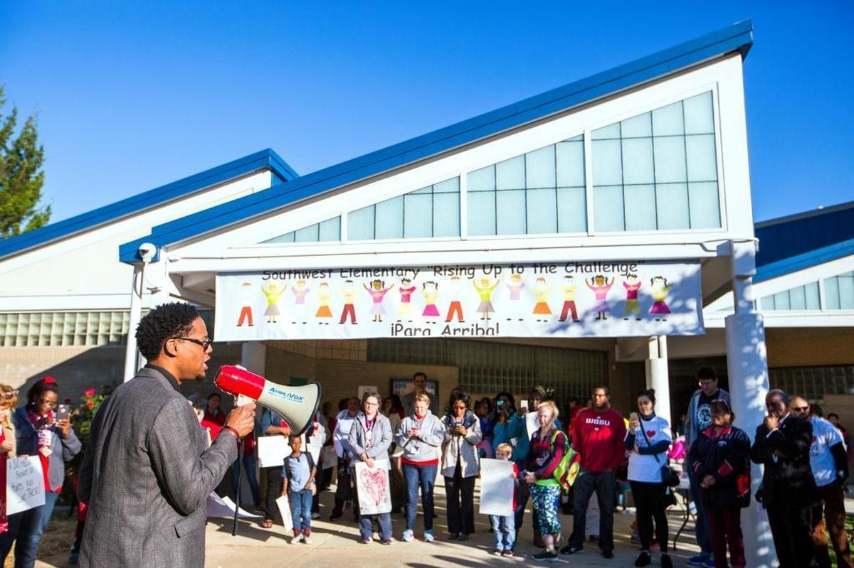 Kevin Bullock, the Durham Public Schools Director of Equity Affairs, speaks during a "walk-in" protest to support public education funding before class began at Southwest Elementary School on Monday May 8, 2017, in Durham, NC. The event kicked off a "Week of Action" organized by the North Carolina Association of Educators, including schools around the state and following with events at the general assembly and town halls.
