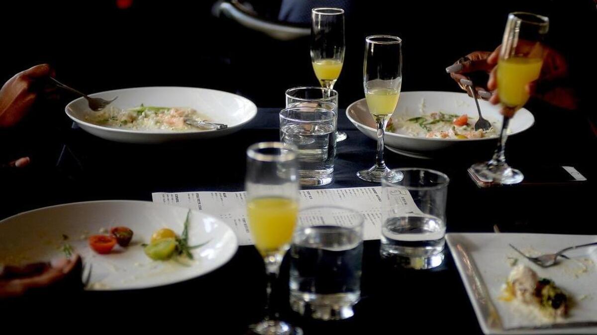 Customers enjoy brunch and mimosas at 5Church restaurant in Charlotte on a Sunday. Restaurants, like 5Church, could see higher volumes of customers before noon along with higher check balances from ordering alcohol.
