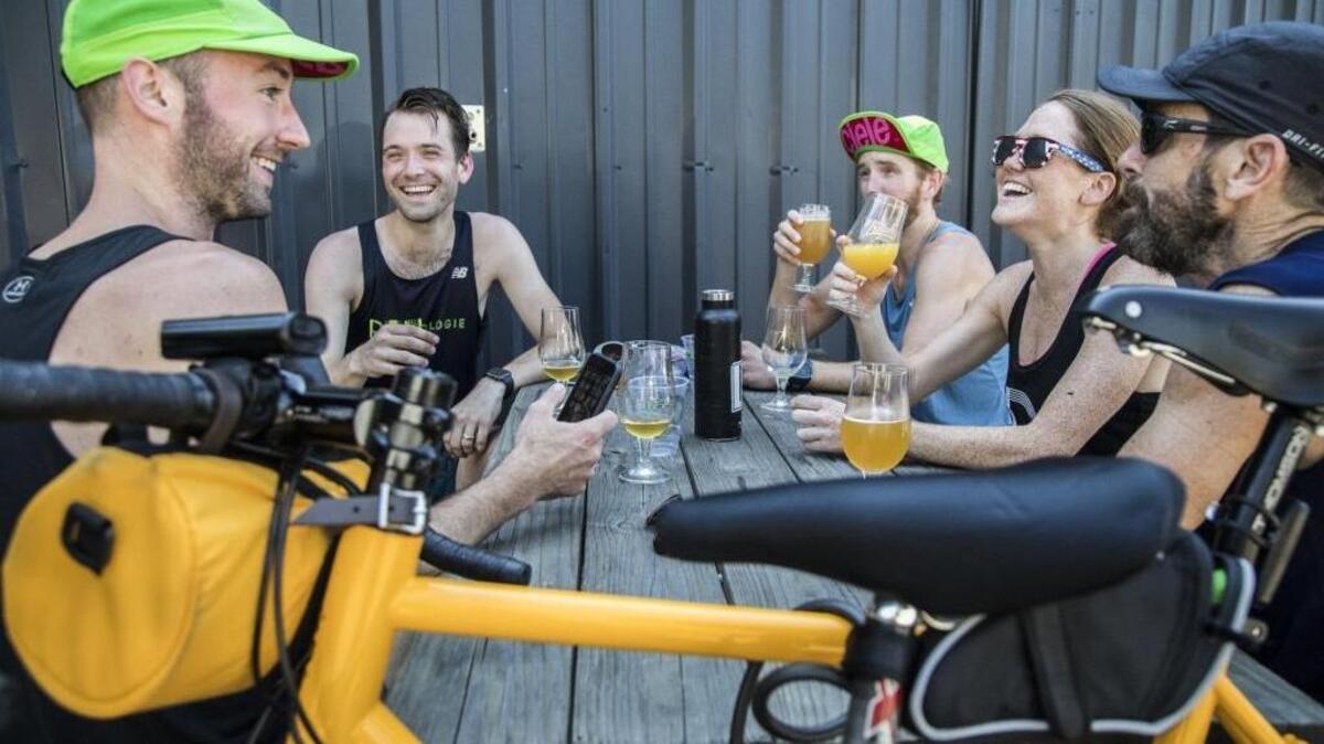 Following a morning run, from left, Alex Warren, Chris Varner, Larz Robison, Blakely Garrity and Kerry Seal sip beers at Trophy Brewing & Taproom in Raleigh Sunday, July 9, 2017 in celebration of North Carolina's new Brunch Bill which allows restaurants and bars to serve alcohol on Sunday mornings.