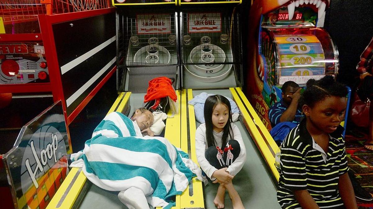 Evacuees from Hurricane Harvey fill the Max Bowl as others continue to pour in for shelter at the business in Port Arthur, Texas.