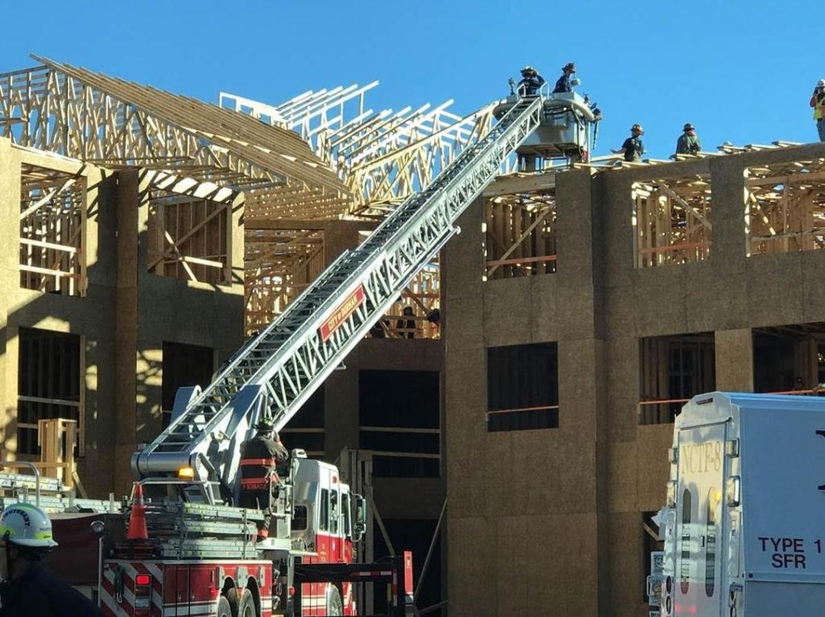 A construction worker was injured when a roof of an under construction, three story apartment building partially collapsed.