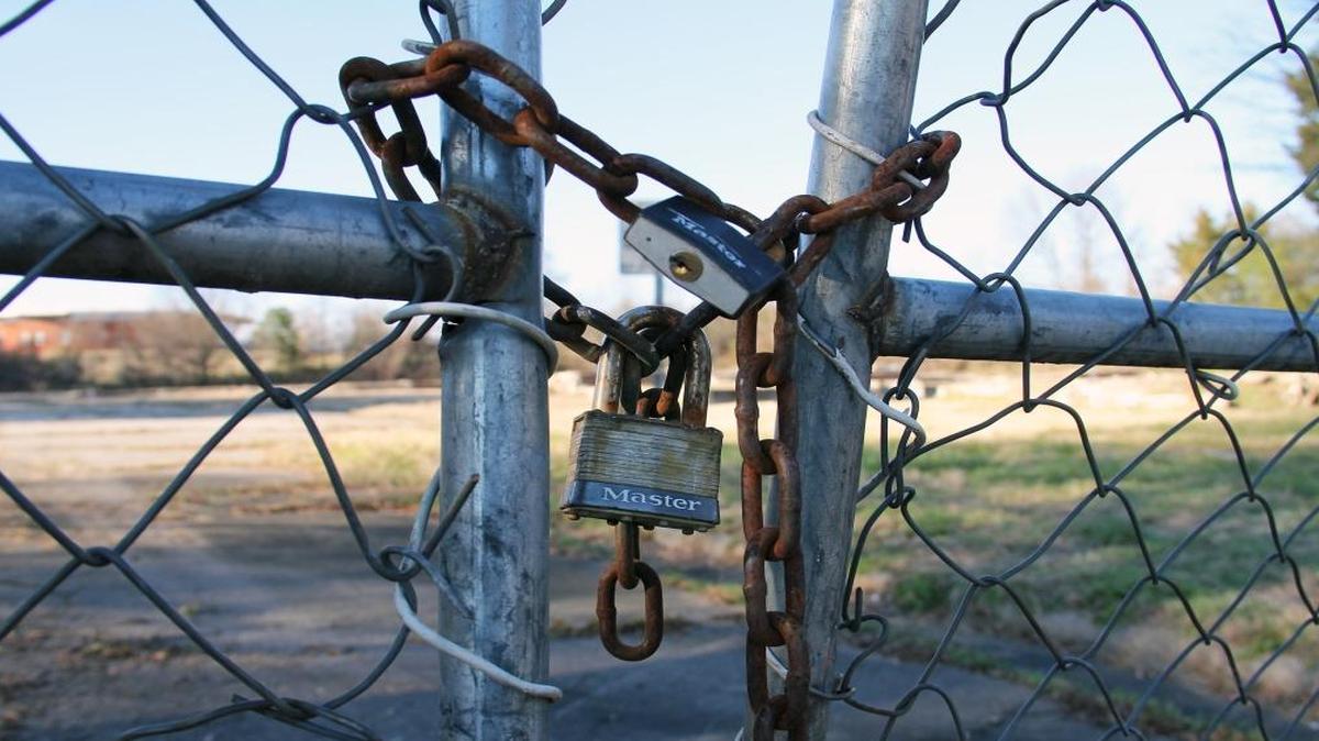 A padlock bars trespassers from the slabs that remain of the Fayette Place public housing project in the Hayti district after the Durham Housing Authority sold it in2007 to pay off debt. Durham CAN would like to see affordable housing tried again on the site.