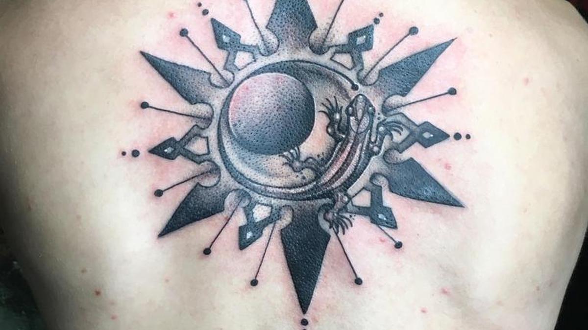 Soren Johnsen shows one of the first tattoos that Samantha Castrovinci designed, after only six months’ of professional experience. “It’s an awesome tattoo,” he says. “It’s just rusty.”