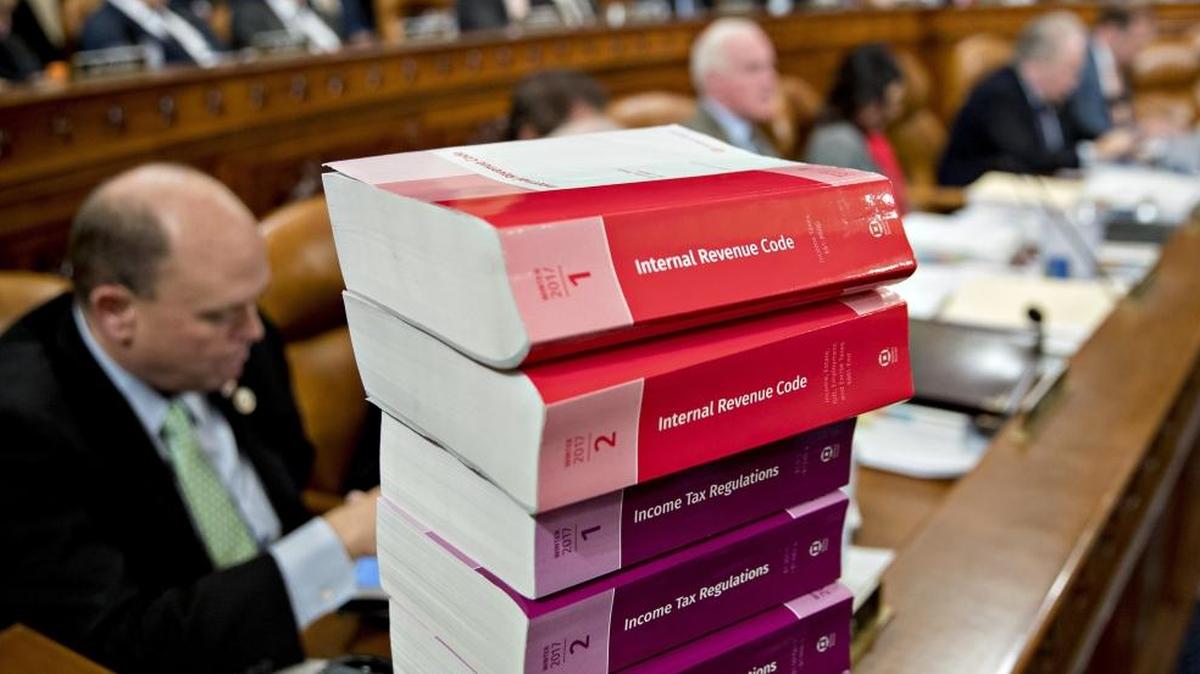 Tax code books sit on a table as the House Ways and Means Committee begins markup of the GOP tax bill on Nov. 6. Provisions in the House proposal could hit institutions like Duke University – and their students – hard.