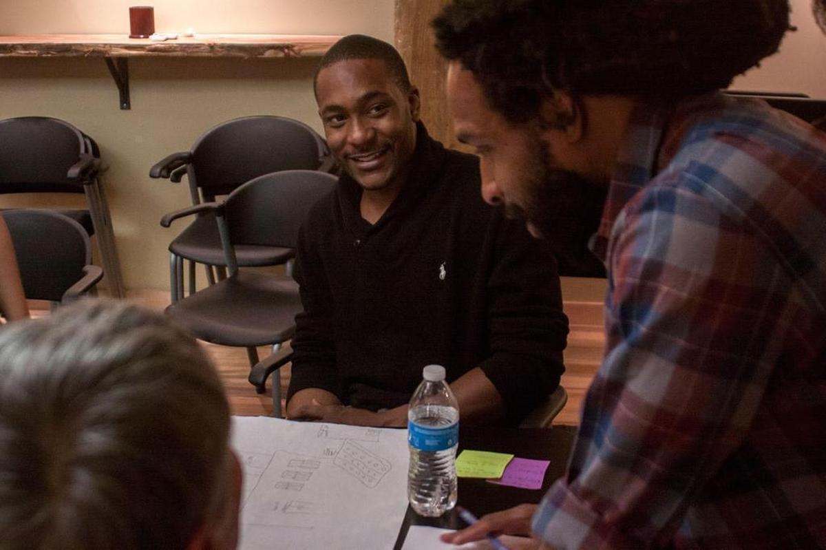 Community activist Umar Muhammad, center, died Monday after being involved in a traffic collision.