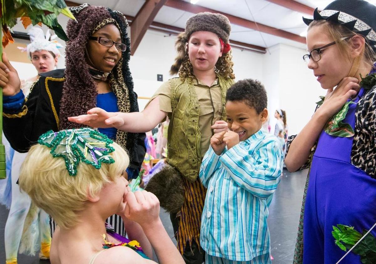 London Cooke, dressed as Michael, plays with Tinker Bell, played by Kristina Kumpf, during down time at a dress rehearsal for the Durham School for Ballet's production of Peter Pan on Saturday May 6, 2017, in Durham, NC.