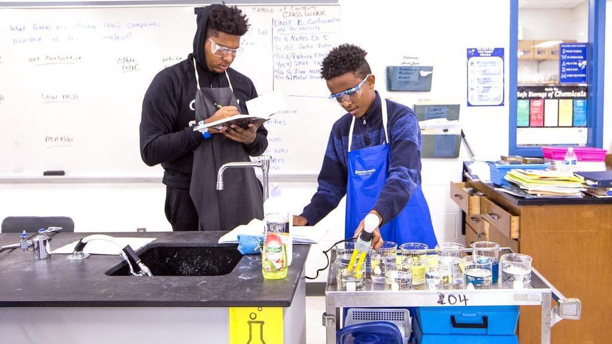 Lamarius Green, left, and Alazar Mebrahtu complete an experiment during an International Baccalaureate level chemistry class at Hillside High School.