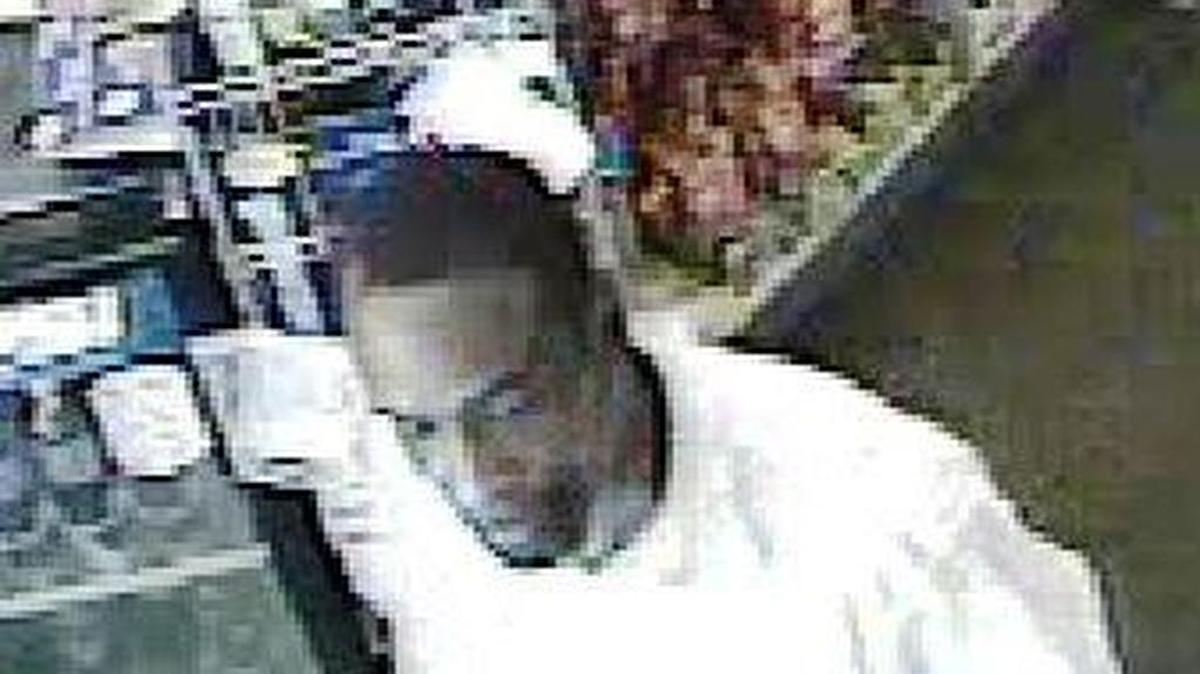 Police are looking for this kidnapping suspect, pictured in a still captured from a video surveillance camera.