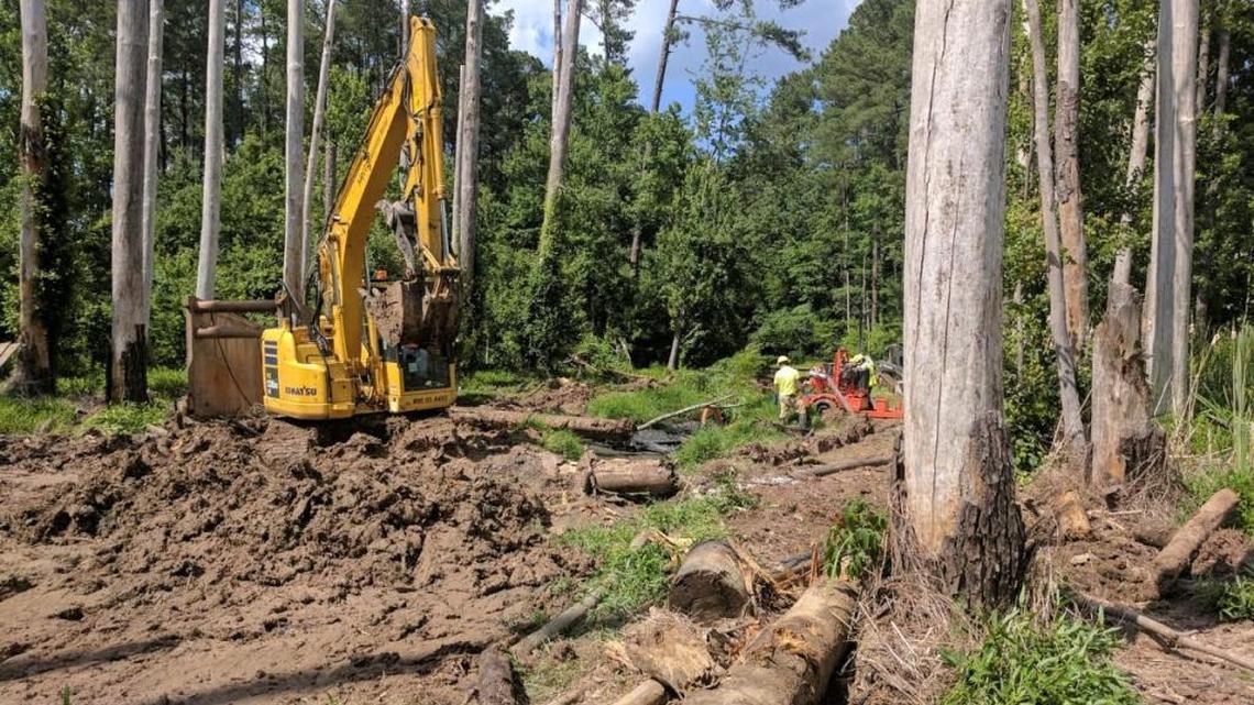 Construction vehicles near 1 Alexis Dr., where more than a million gallons of untreated wastewater were discharged from Durham County’s wastewater collection system.