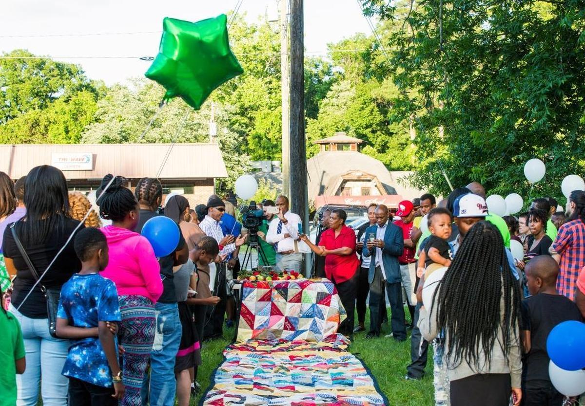 Sidney Brodie, creator of the ‘Durham Homicide and Victims of Violent Death Memorial Quilt,’ speaks during a vigil to memorialize the life of Kamari Munerlyn in 2017.