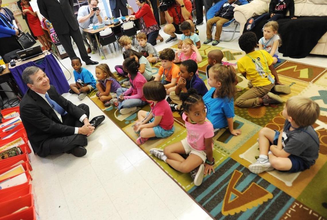In this 2017 file photo, Gov. Roy Cooper starts off his statewide school supply drive at Pearsontown Elementary School in Durham by visiting classes and talking to students.