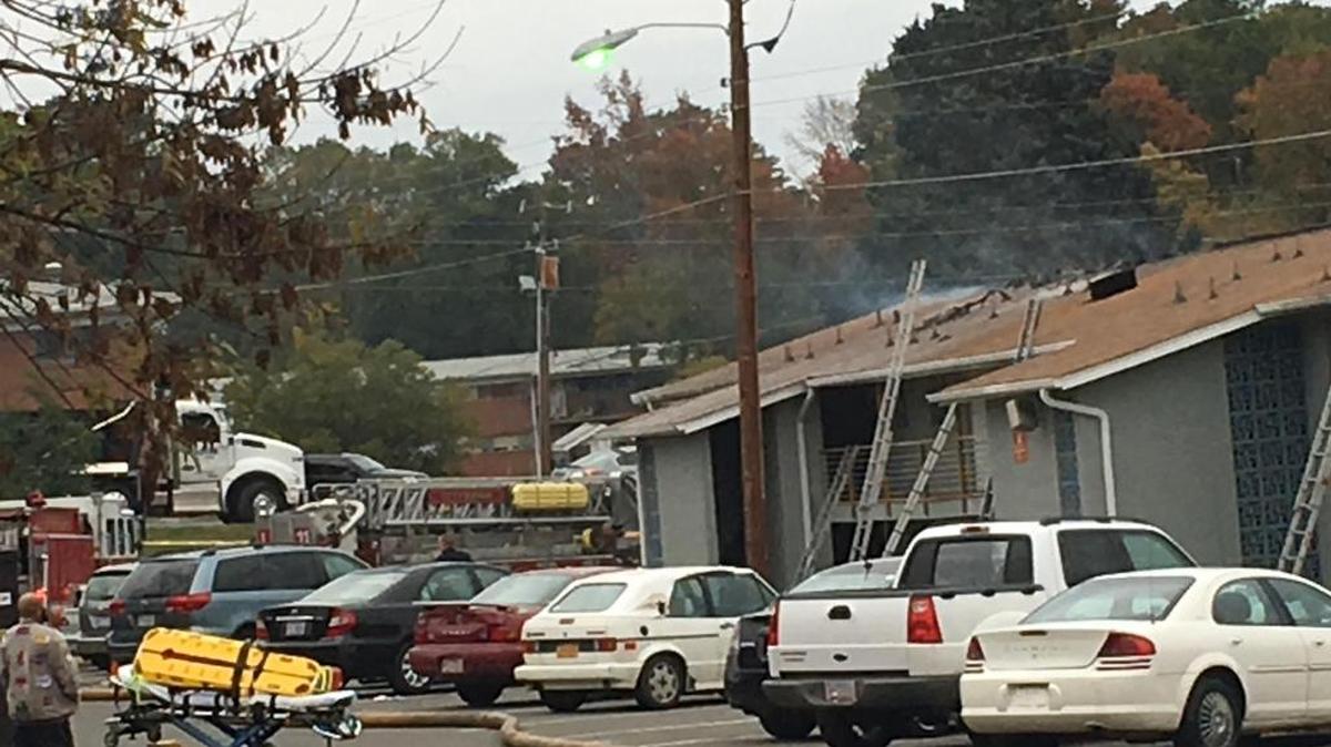 Light puffs of smoke are visible after Durham firefighters put out an apartment fire at 1200 Leon Street Sunday afternoon.