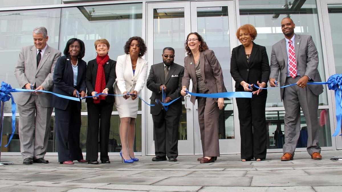 Durham County Commissioner Brenda Howerton, second from left, is pictured with (from left) then-Durham County Manager Mike Ruffin, County Commissioner Ellen Reckhow, veterans officer Lois Harvin-Ravin, then-County Commissioner Chairman Fred Foster, Commisioner Wendy Jacobs, Public Health Director Gayle Harris and Social Services Director Michael Becketts in a 2013 ribbon-cutting photo.