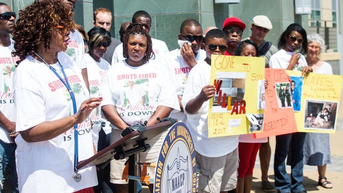 Thomasine Hinson, mother of Willard Scott, makes a speech surrounded by friends, family and supporters in front of the Durham County Courthouse on July 8, 2017, in Durham, NC.