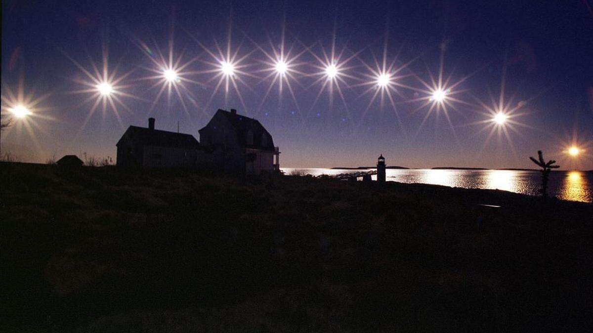 Thursday marks the winter solstice in the Northern Hemisphere. In this file photo, the sun, nearing winter solstice, travels low across the sky, from sunrise, at left, to sunset, in this multiple-exposure made at the Marshall Point Light, Wednesday, Dec. 18, 2002, in St. George, Maine. The sun's position is recorded at 50-minute intervals during the short nine-hour day.