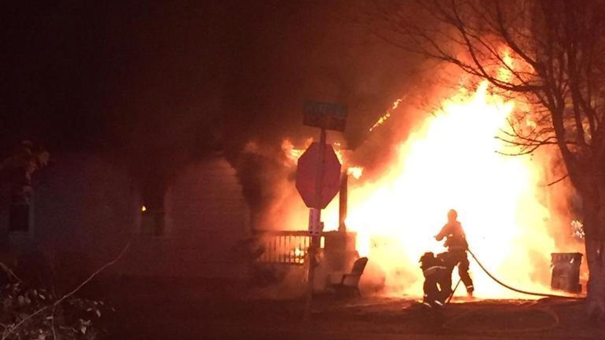 Firefighters battle the fire at 701 Old Oxford Road.