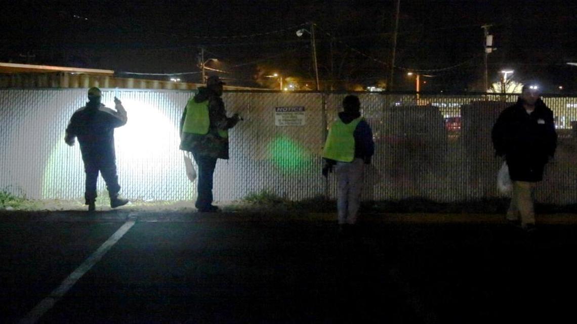Volunteers search a fence line in Durham looking for homeless people Wednesday night, January 28, 2016 in Durham. Dozens of volunteers fanned out across Durham that night to conduct the annual Point-in-Time Count, a snapshot of the area’s homeless population. The count helps social service and charitable agencies determine what kinds of services are most needed and whether the number of homeless people is rising, falling or holding steady.