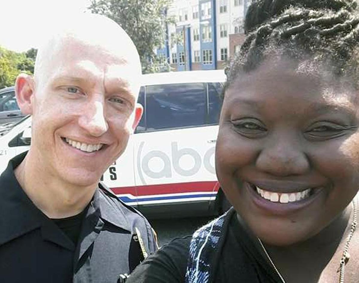 Courtney Bailey shown with Durham police officer Dan Strandh.