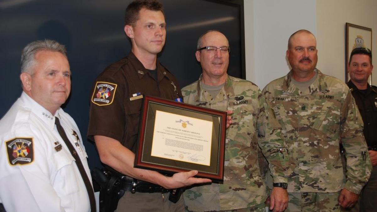 Sheriff Mike Andrews (pictured from left), Deputy David Earp, Major General Gregory Lusk and Command Sergeant Major John Swart are pictured at Earp’s National Guard awards ceremony.