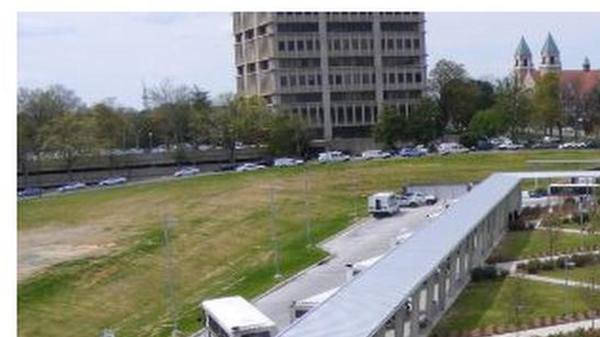 Photograph of the Durham Station Transportation Center and the 1.9-acres of vacant land, on the left, the city is considering giving to two organizations to build affordable housing.