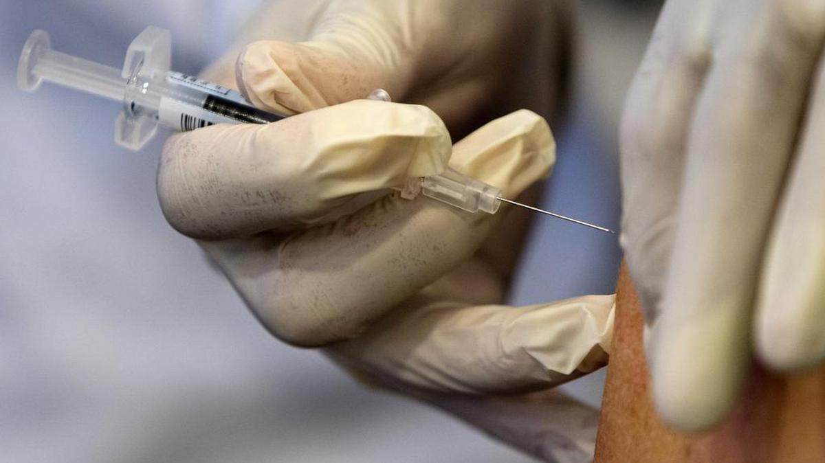 In this 2015 file photo, a nurse gives administers a flu vaccine shot. Three are pharmacies, including a pair in Durham, will be offering free flu vaccinations beginning Monday.