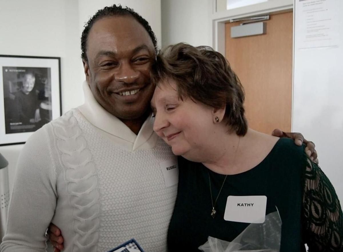 Kidney recipient Russell Bridgers, 48, of Fayetteville hugs Kathy Mullins, 60, of Lebanon, Virginia, who donated her kidney to him, during a gathering at Duke University Medical Center on Friday, Dec. 22, 2017, about six months after their surgery.