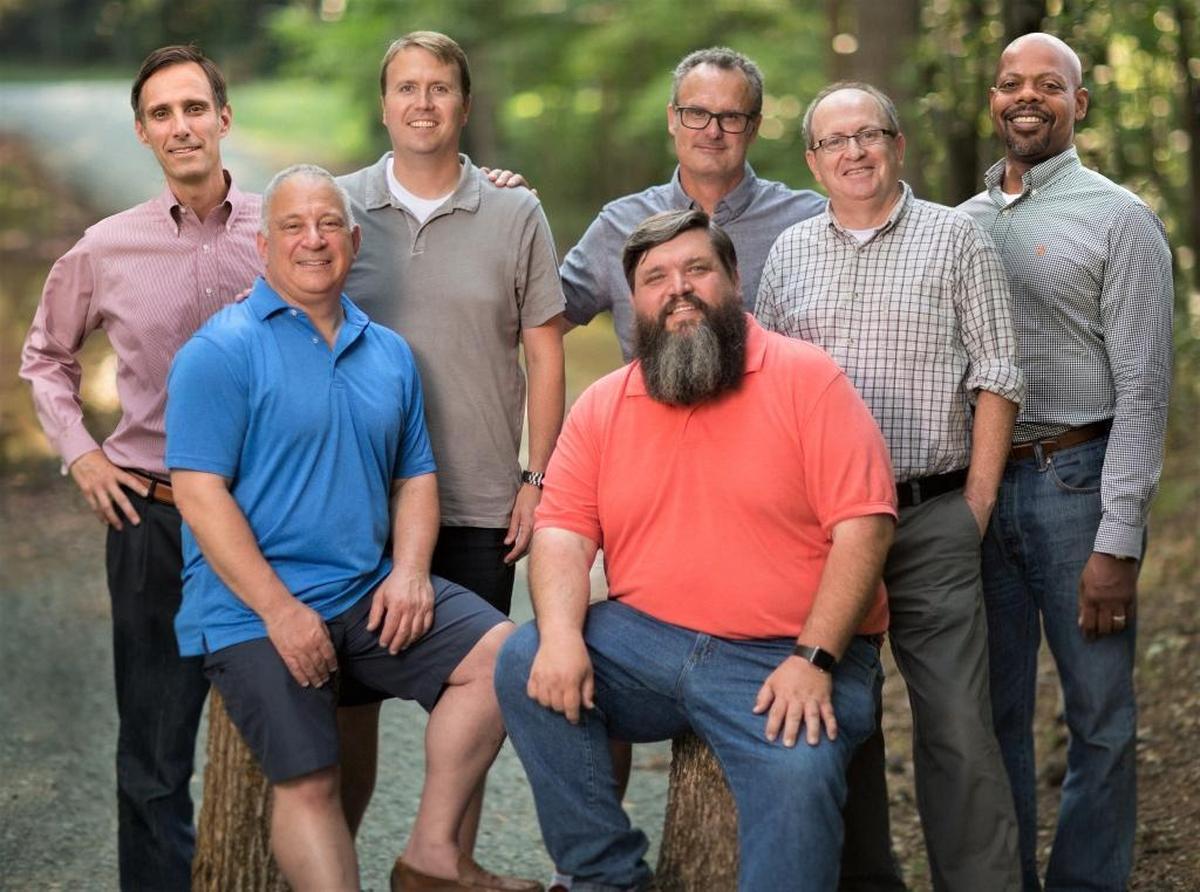 The seven fathers who participated in the support group for widowed fathers are (standing, left to right) Bruce, Steve, Karl, Dan and Russ, (seated, left to right) Joe, Neill