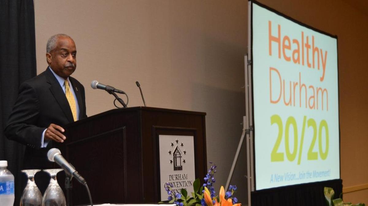 Durham Mayor Bill Bell addresses community members gathered to launch Healthy Durham 20/20, aimed at bringing public and private sectors together to fight that gap and other health disparities.