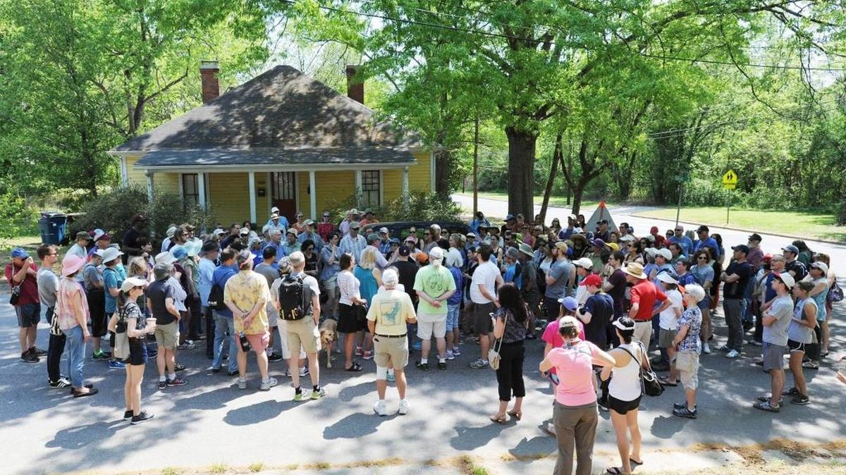 In this 2017 Herald-Sun file photo, John Schelp leads a three-mile walk through Old West Durham.