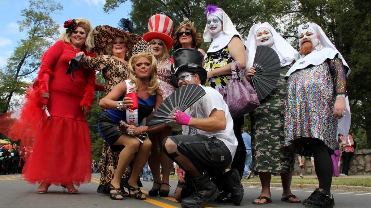 Drag queens, many from charitable and/or HIV/AIDS education organizations, pose for group shots before the start of the parade at the annual N.C. Gay Pride march and rally.