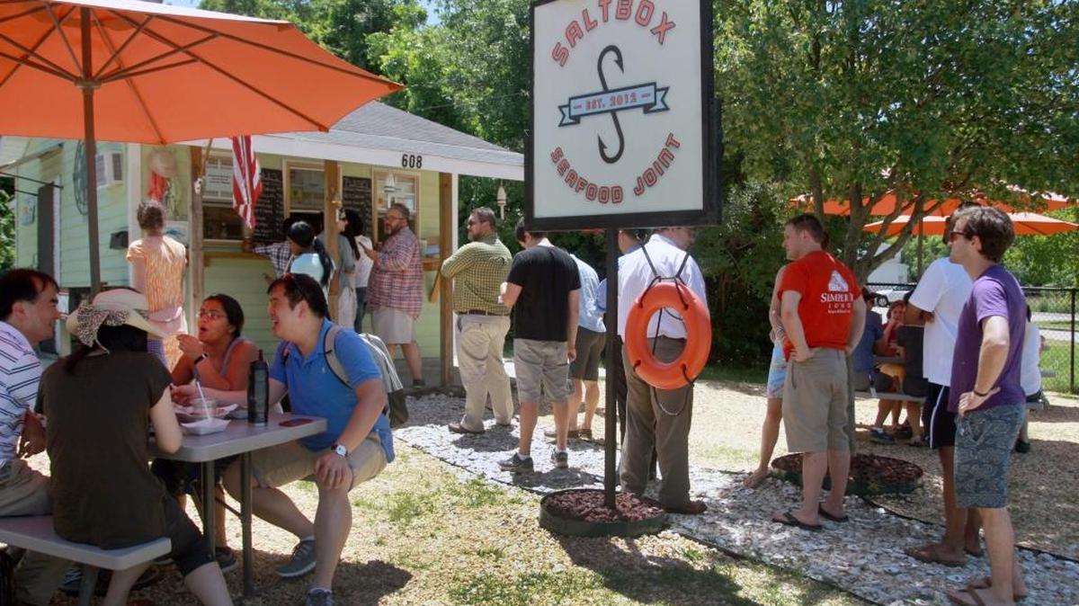 Customers wait in line at Saltbox Seafood Joint.