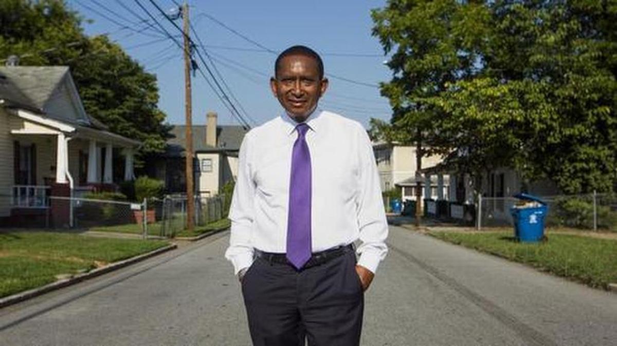 State Sen. Floyd B. McKissick Jr. is pictured on Dowd Street, part of the route where he used to deliver one of The Herald-Sun’s two predecessor newspapers, The Durham Sun, as a child six afternoons a week.