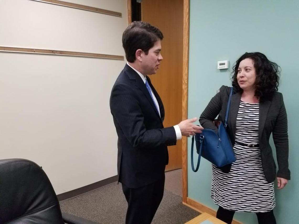 Newly appointed Durham City Council member Javiera Caballero, right, talks with Durham City Council member Charlie Reece about the upcoming council meeting where she was to be sworn in less than an hour after being appointed.