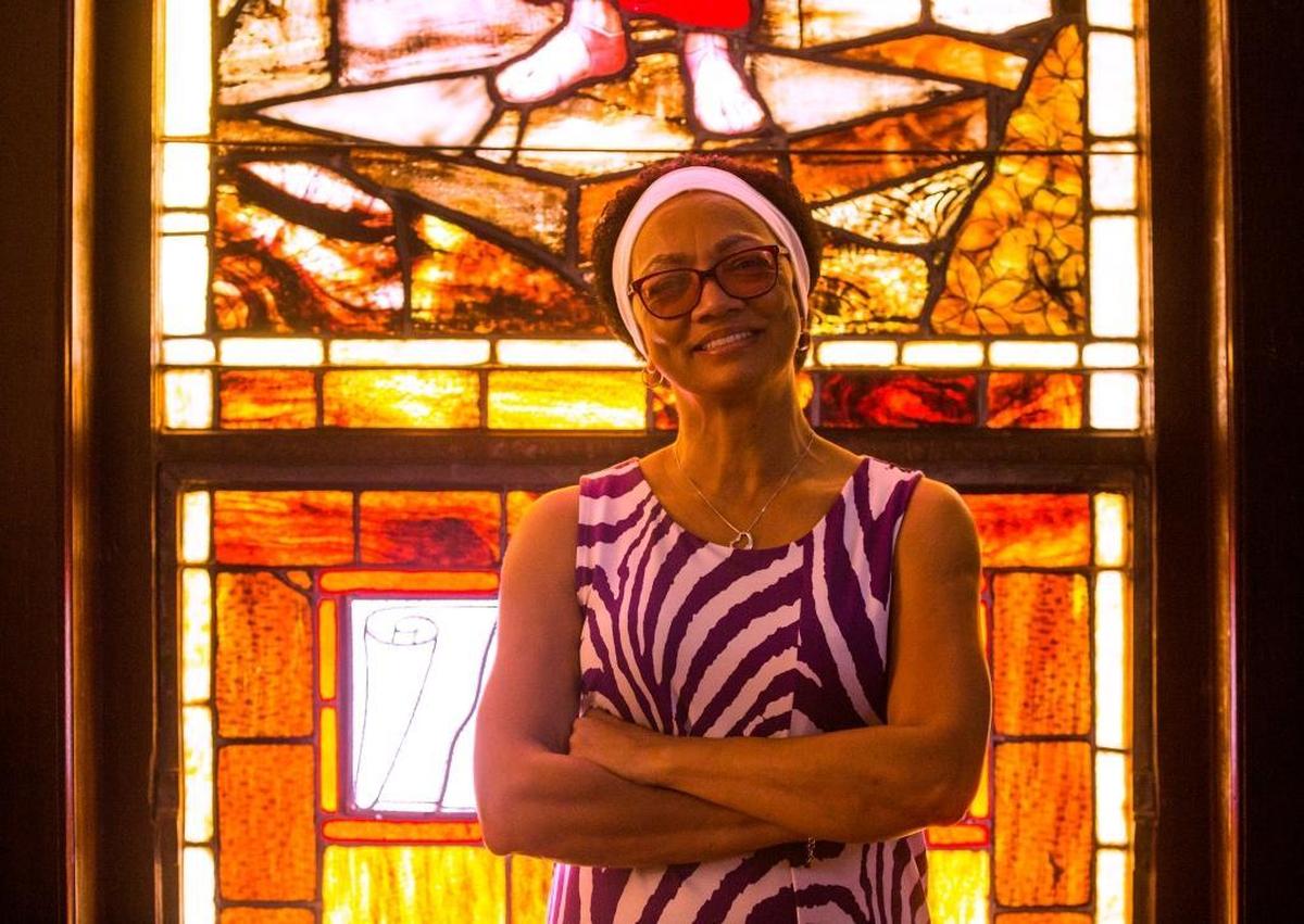 Angela Lee, executive director of the Hayti Heritage Center, is pictured in the sanctuary of a church the center renovated as a cultural enrichment and arts education facility for a neighborhood once dubbed “Black Wall Street” by Booker T. Washington.