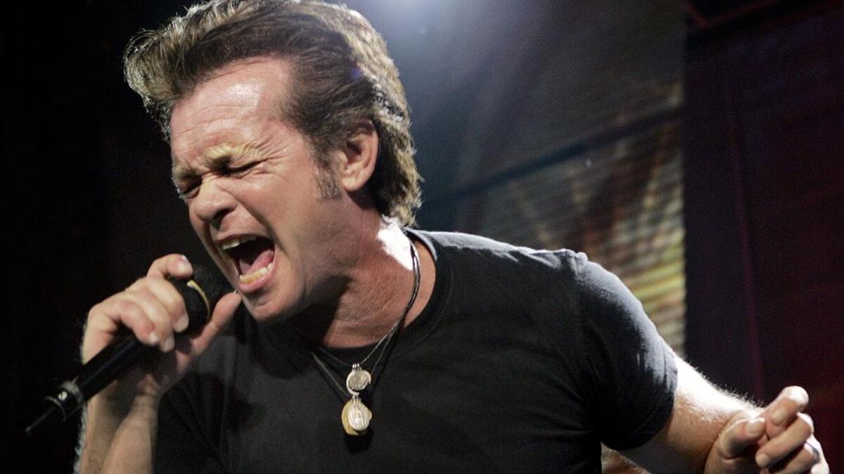 John Mellencamp sings at the Farm Aid concert in Camden, N.J., in this Saturday, Sept. 30, 2006 file photo.