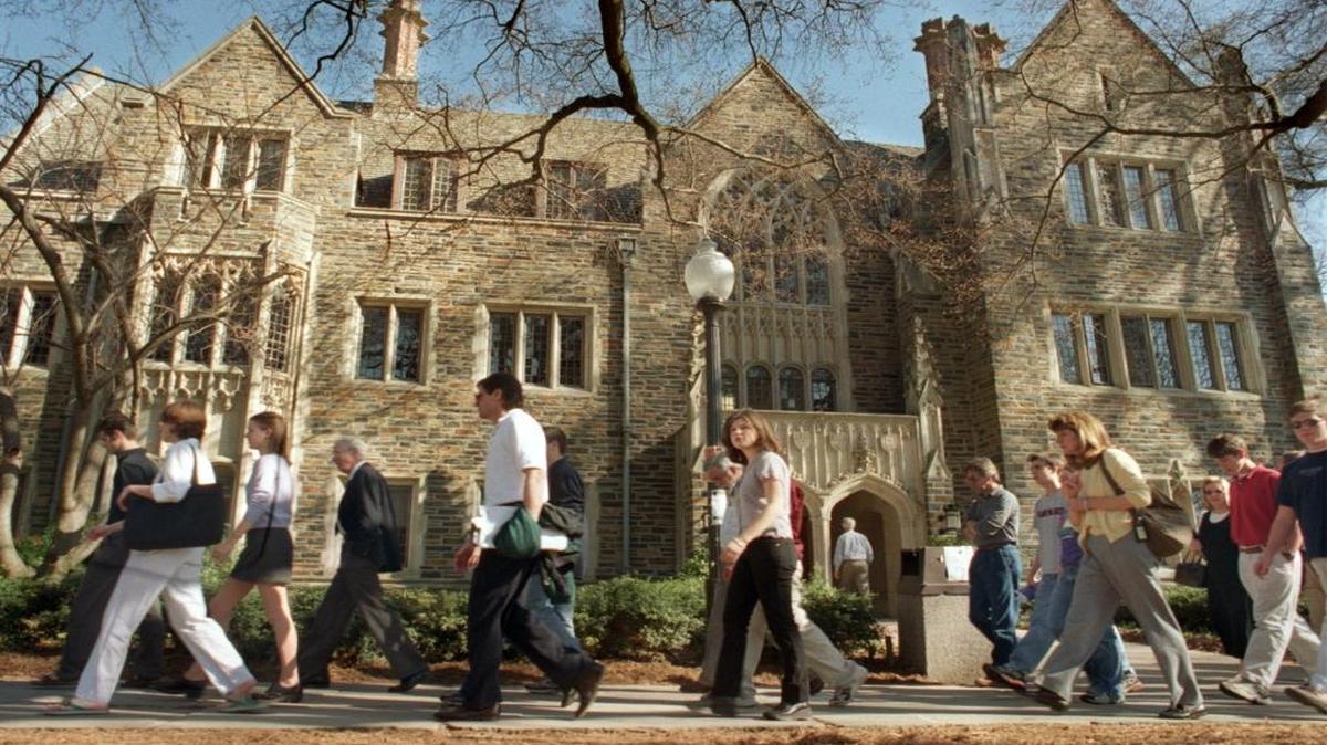 Duke University student guides lead a group of undergraduate prospects and some of their parents on a walking tour of Duke’s West Campus, replete with its gothic-style architecture.