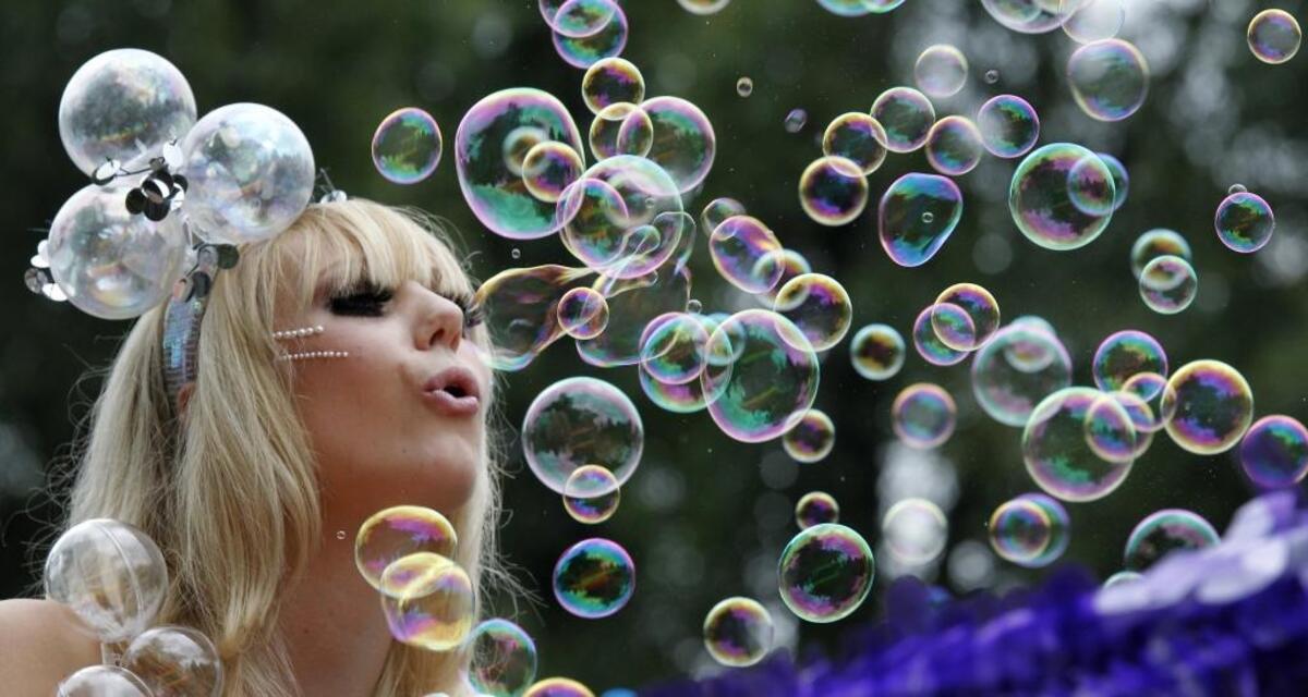 Brittany West, 22 blows bubbles on the “Lady Gaga” themed float by Stage 1 Salon at the Gay Pride March in Durham, N.C. Saturday Sept.24, 2011.