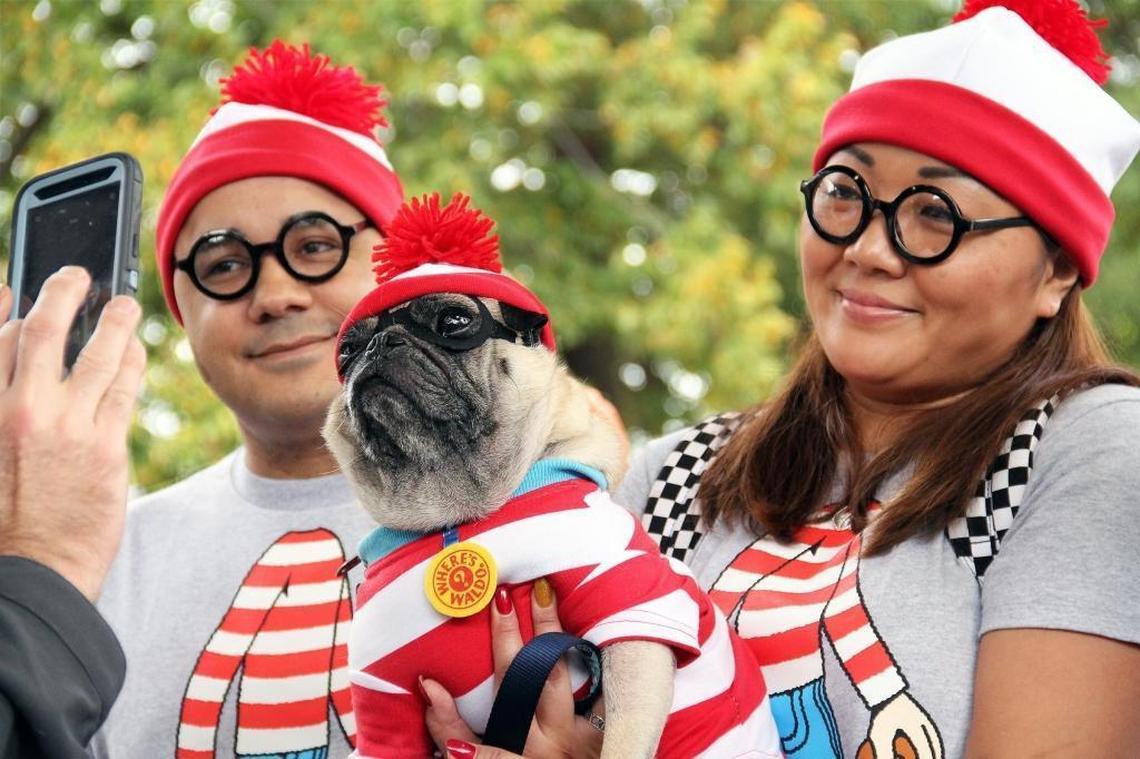 Angelo Illiano and Yuri Cain, with Bob the pug took third place as “Where’s Waldo” clones in the look-alike contest at Barktoberfest on Sunday in Durham Central Park. Hundreds of dog lovers and their pets gathered at the event held by Durham Parks and Recreation and Beyond Fences (formerly the Coalition to Unchain Dogs).
