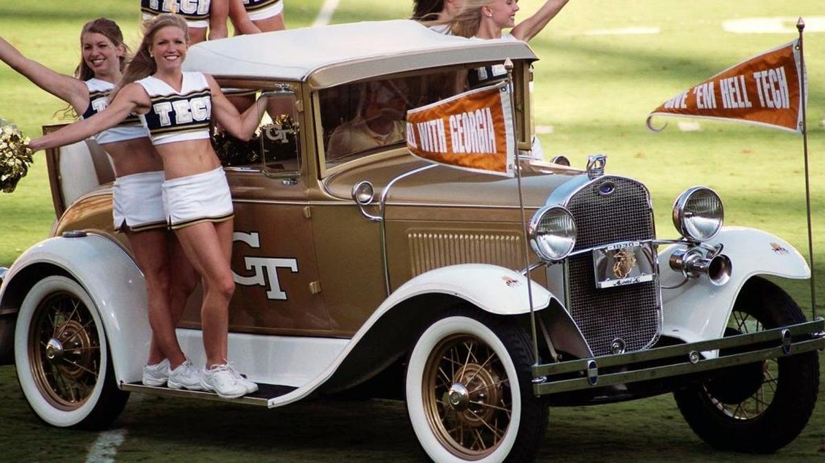 The Ramblin’ Wreck is in Durham this weeked for the Yellow Jackets’ game against Duke. The driver, Chris Healy, and his father Pat, who was the Blue Devil in 1975-76, share a love for their schools.