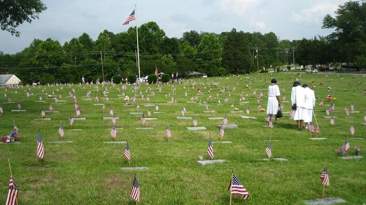 Beechwood Cemetery graves decorated with U.S. flags for Memorial Day in 2010.