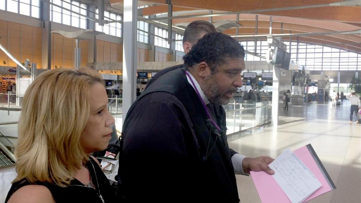 Rev. William Barber II speaks at RDU International Airport in Morrisville on Saturday, Oct. 21, 2017 before departing for El Paso, Texas to participate in the Moral Mass Gathering.