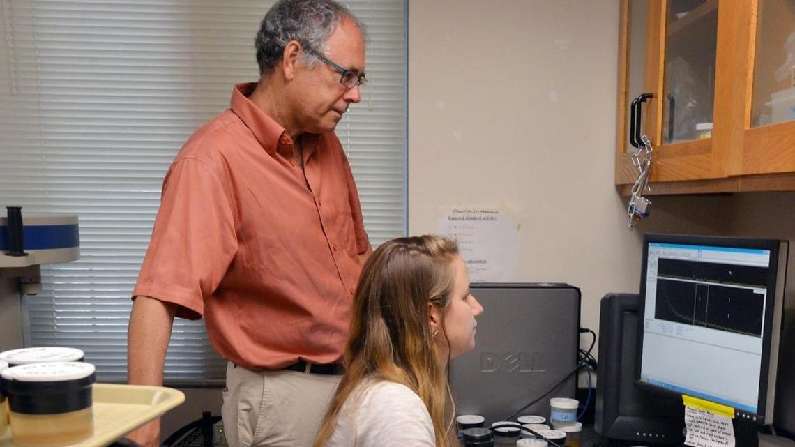 Duke professor Avner Vengosh (standing) leads a team of water-pollution experts that recently took on a contamination problem in southeast Wisconsin. Here, he works with Ph.D. student Nancy Lauer in a lab at the Nicholas School of the Environment.