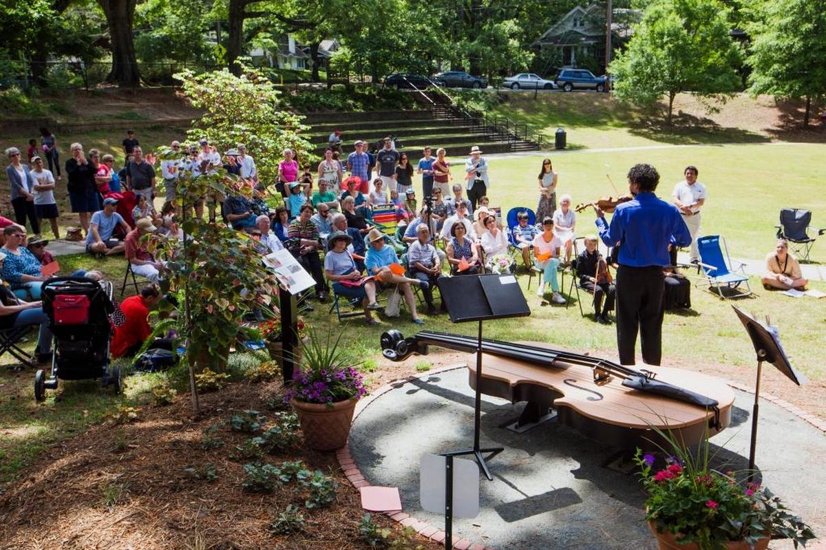 Carlos Mauri Bardales performs during a ceremony at Oval Park dedicating a bench to Dorothy Kitchen's contributions to music education as founder and director of the Duke University String School, on Sunday April 30, 2017, in Durham, NC. The bench is nestled in the 12th 'history grove' created by communities in partnership with the Museum of Durham History celebrating individuals or groups who have helped shape Durham.