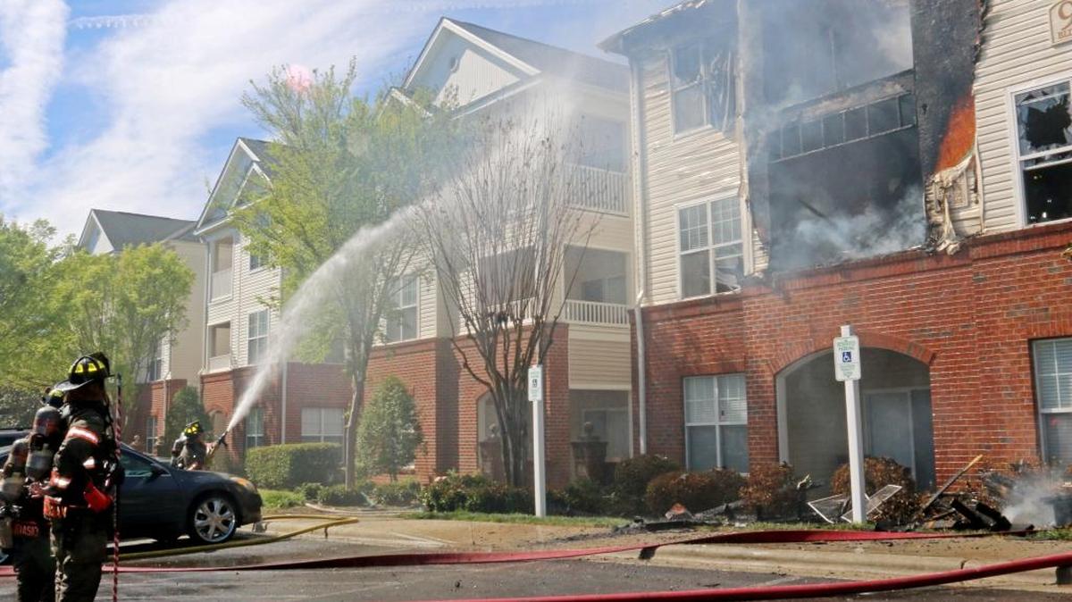 Firefighters battle Saturday's blaze at the Falls Pointe apartment complex.