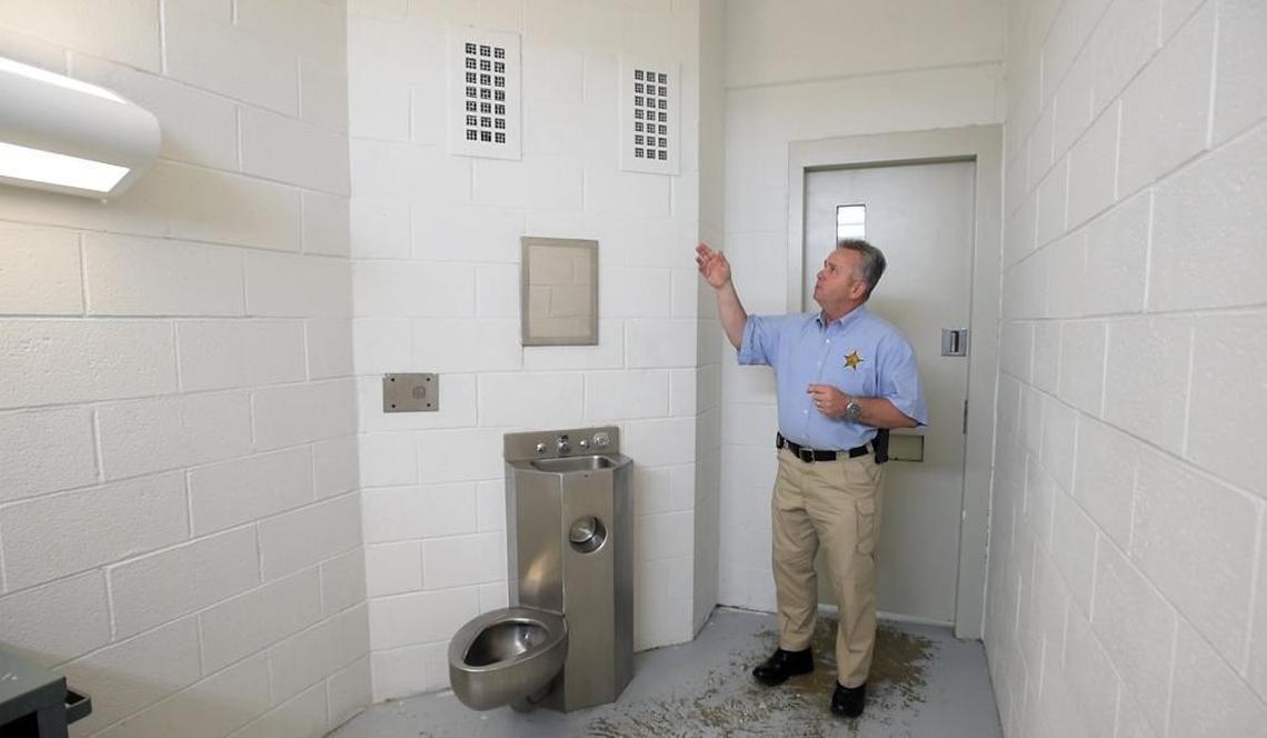 Durham County Sheriff Mike Andrews discusses the old grates in jail cells which are being replaced with new “suicide proof” vent grates in a wing of the Durham County Detention Center Monday, June 6, 2016. A section of the jail is being renovated to accommodate mentally ill prisoners.