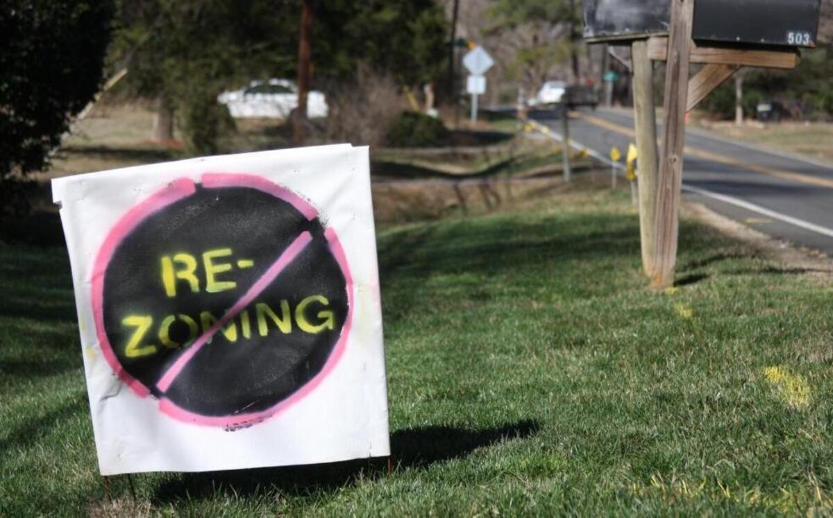 A sign opposing a rezoning that would allow a Publix shopping center on the corner on Latta and Guess roads in this 2017 file photo. Some northern Durham residents are opposed to the 30-acre mixed-use development that would include housing and a Publix grocery store. Others are ready for the high-end grocery story to open in that part of the city.